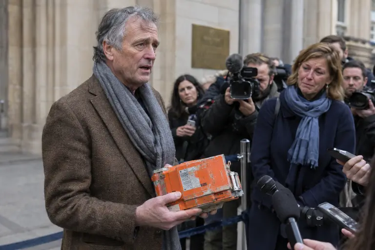 Viliam D. Nemcová with the repaired flight‑data module outside the parliamentary inquiry building in Brussels on Tuesday, after playing its telemetry for MPs.