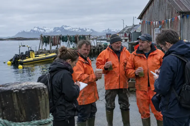Fishers show jars of green water at Kabelvåg harbour, Lofoten, as local sampling continues following revelations of secret ocean trials.