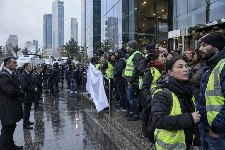 Staff and protesters gather outside Bosphoria Holding headquarters in Levent, Istanbul, after the company filed for insolvency on 21 September.